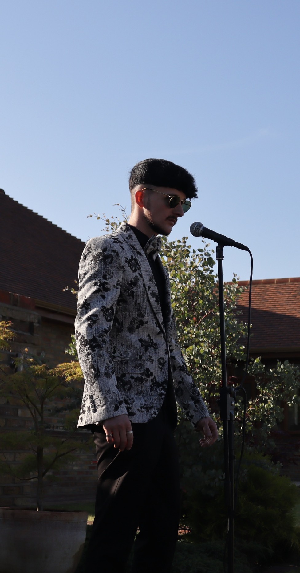 Jake Essex singing outdoors