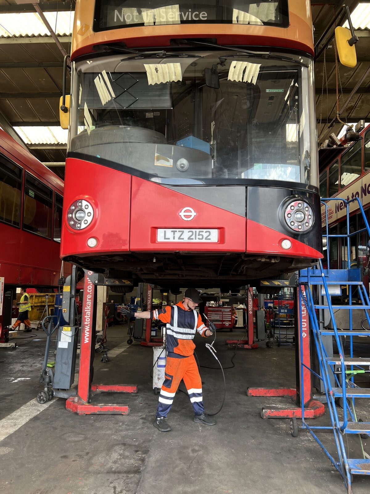 Jake Essex under a London bus