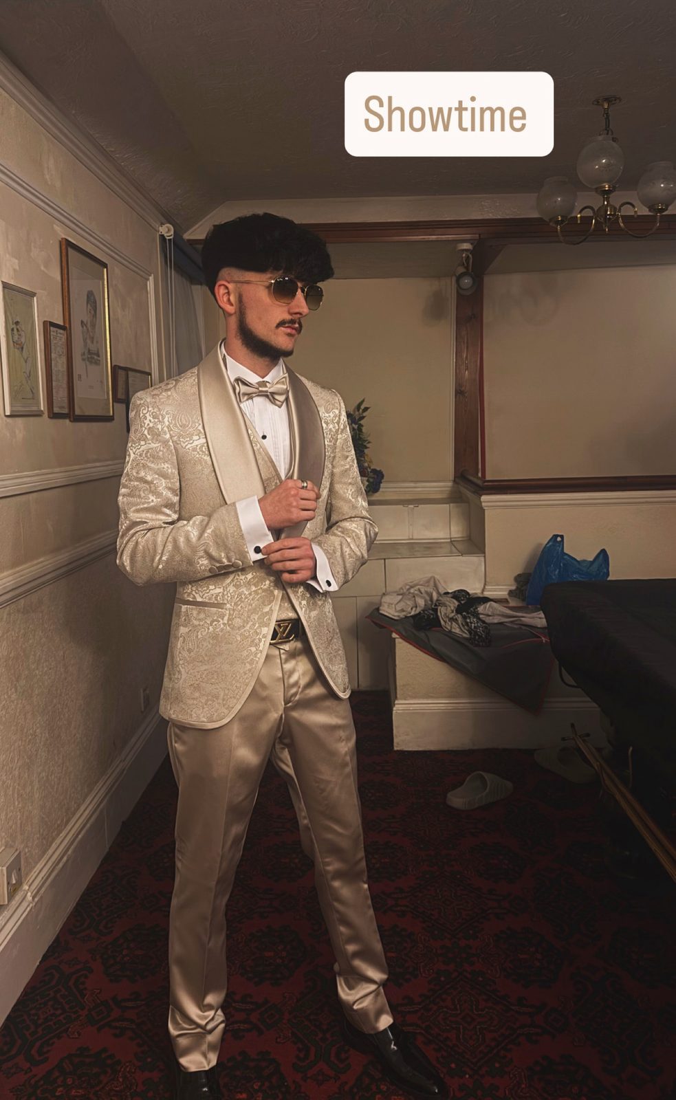 Jake Essex in a champagne dinner jacket and matching bow tie